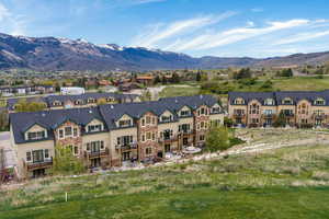 Aerial view of residential area with a mountainous background