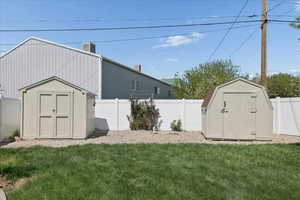 View of shed featuring a fenced backyard