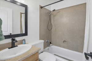 Full bathroom with vanity and shower / bath combination with curtain