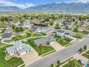 Aerial view of residential area featuring a mountain backdrop