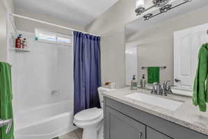 Bathroom with vanity and shower / bath combo