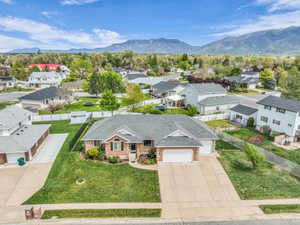 Aerial view of residential area featuring a mountain backdrop