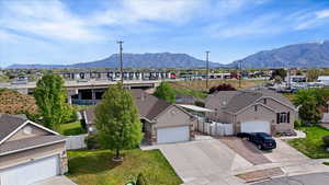 Aerial perspective of suburban area featuring a mountain backdrop