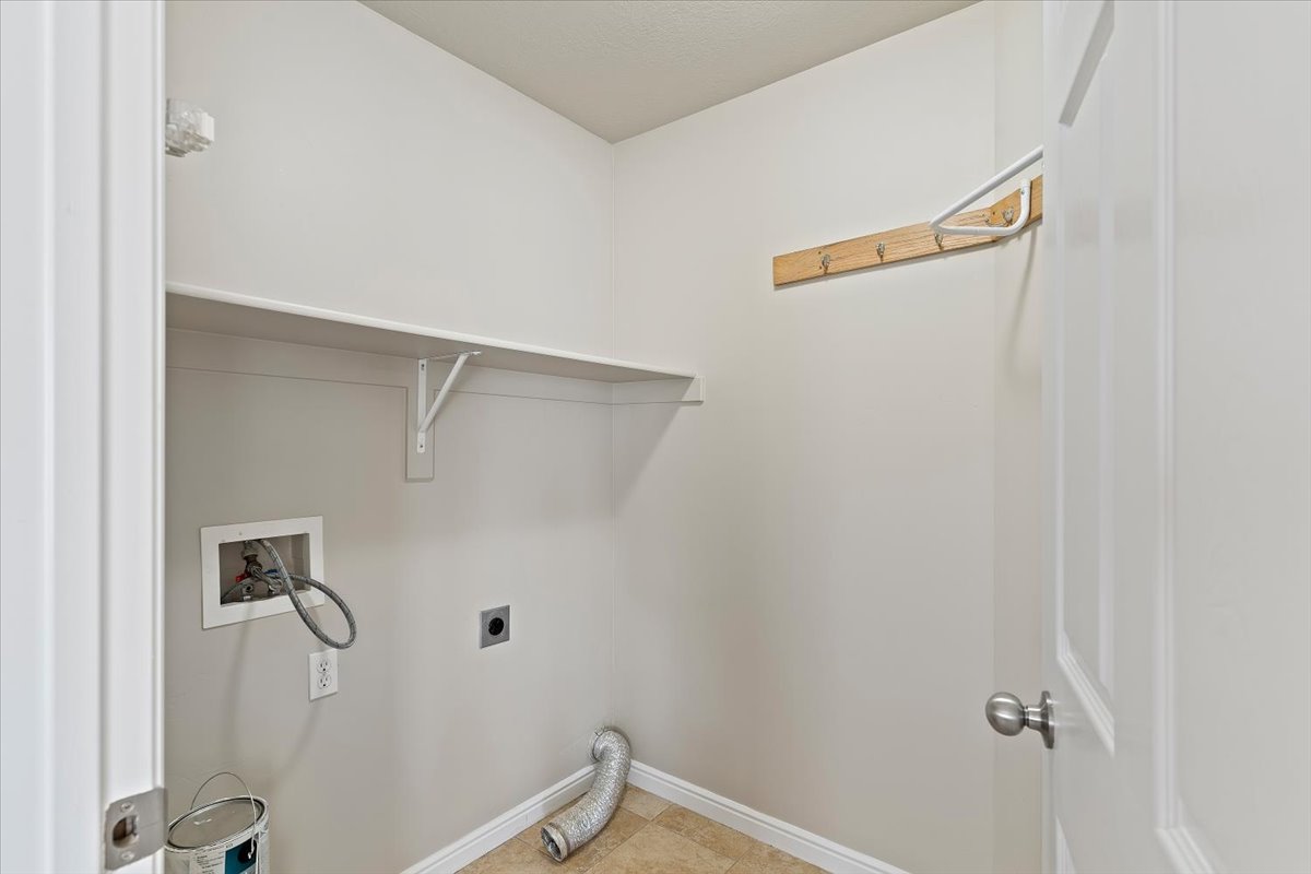 Laundry area with washer hookup and hookup for an electric dryer