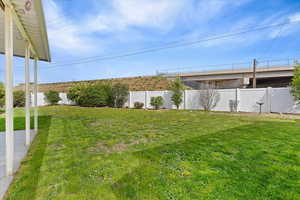 View of fenced backyard
