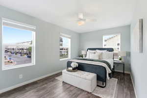 Bedroom with wood finished floors and a ceiling fan