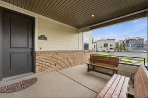 Covered porch with a residential view