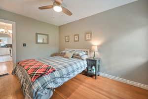 Main floor bedroom with attached half bath