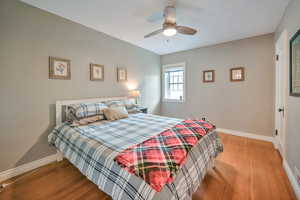 Main floor bedroom with attached half bath