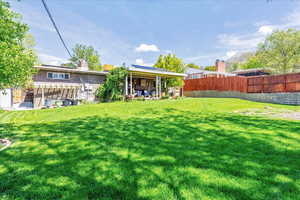 Fenced backyard featuring a patio area