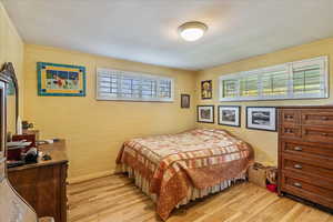 Bedroom with light wood-style flooring