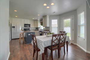 Dining room featuring recessed lighting and dark wood-style flooring