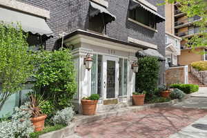 Doorway to property with brick siding