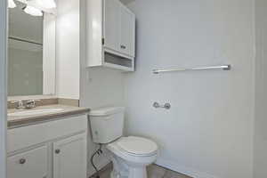 Bathroom with vanity, a shower, and light tile patterned floors