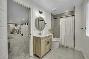 Full bath with vanity, recessed lighting, shower / bathtub combination with curtain, light carpet, and light tile patterned flooring