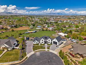 Aerial perspective of suburban area with a mountain backdrop