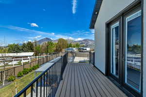 Balcony featuring a mountain view and a residential view