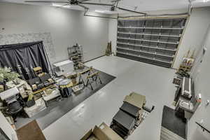Living room with finished concrete floors and a garage