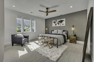 Bedroom featuring brick wall, a ceiling fan, an accent wall, recessed lighting, and light colored carpet