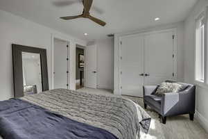 Bedroom with a closet, recessed lighting, and a ceiling fan