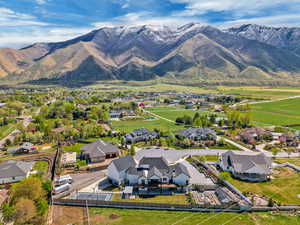 Aerial perspective of suburban area featuring a mountain backdrop