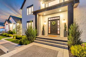 View of exterior entry at dusk