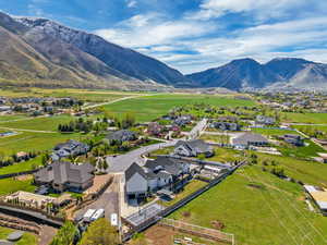 Aerial perspective of suburban area featuring a mountainous background