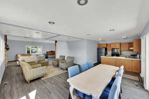 Dining area with light wood-style flooring