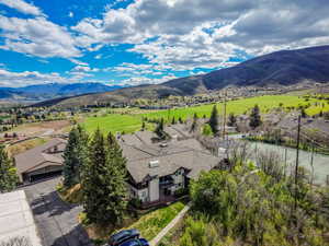 Aerial perspective of suburban area with a mountain backdrop