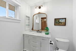 Bathroom featuring vanity and plenty of natural light