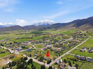 Aerial perspective of suburban area with a mountain backdrop
