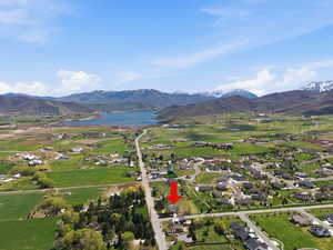 Aerial perspective of suburban area with a water and mountain view