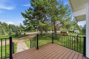 Deck with a yard and an outbuilding