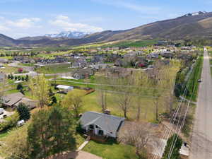 Aerial view of residential area featuring a mountainous background
