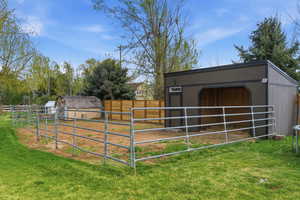 Horse barn featuring a view of rural / pastoral area