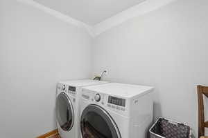 Laundry area with washing machine and clothes dryer
