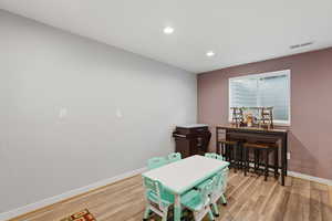 Game room featuring light wood finished floors and recessed lighting
