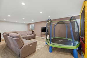 Rec room with light carpet and recessed lighting