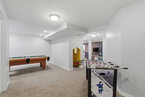 Rec room with light carpet, billiards, a textured ceiling, and recessed lighting