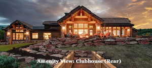 Back of house at dusk with a patio area and a metal roof