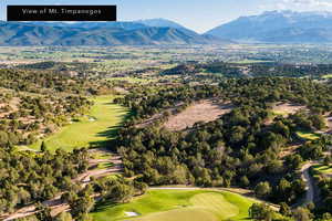Drone / aerial view of a golf club and a mountain backdrop