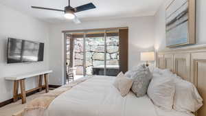 Bedroom with carpet floors, access to outside, and a ceiling fan