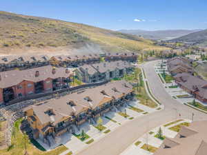 Aerial view of residential area featuring a mountainous background