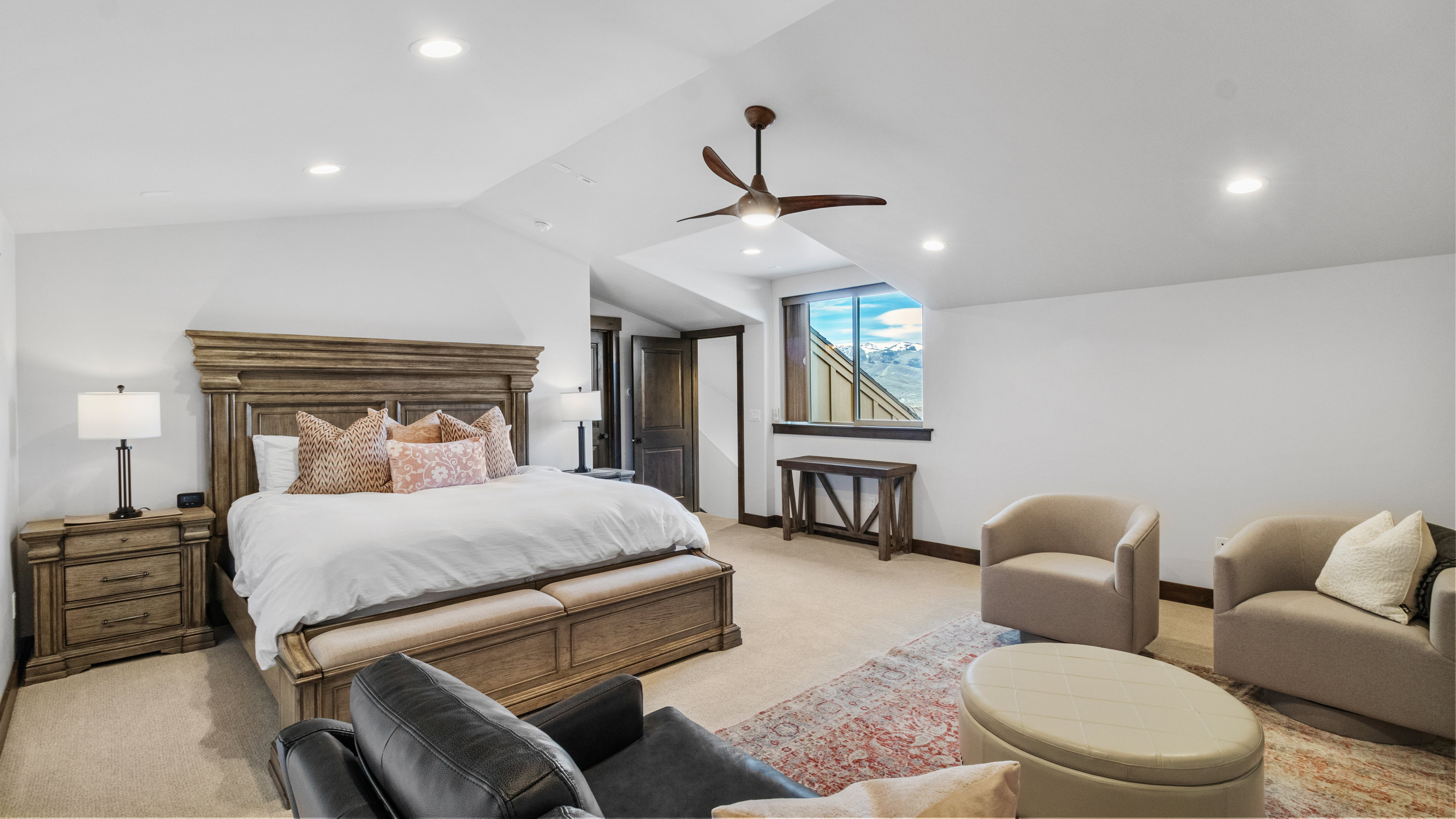 Bedroom with light colored carpet, recessed lighting, lofted ceiling, and a ceiling fan