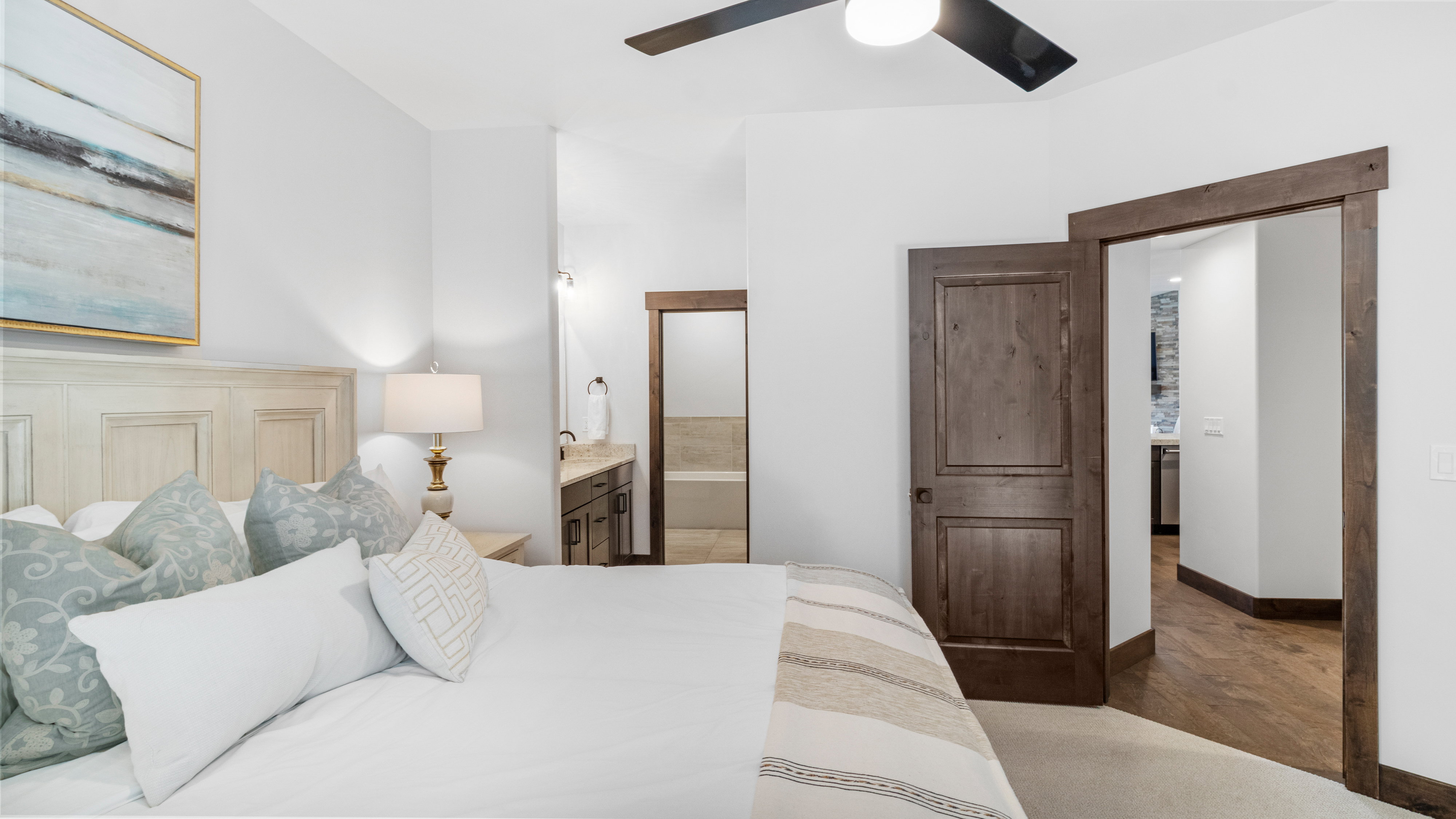Bedroom with ensuite bathroom and ceiling fan