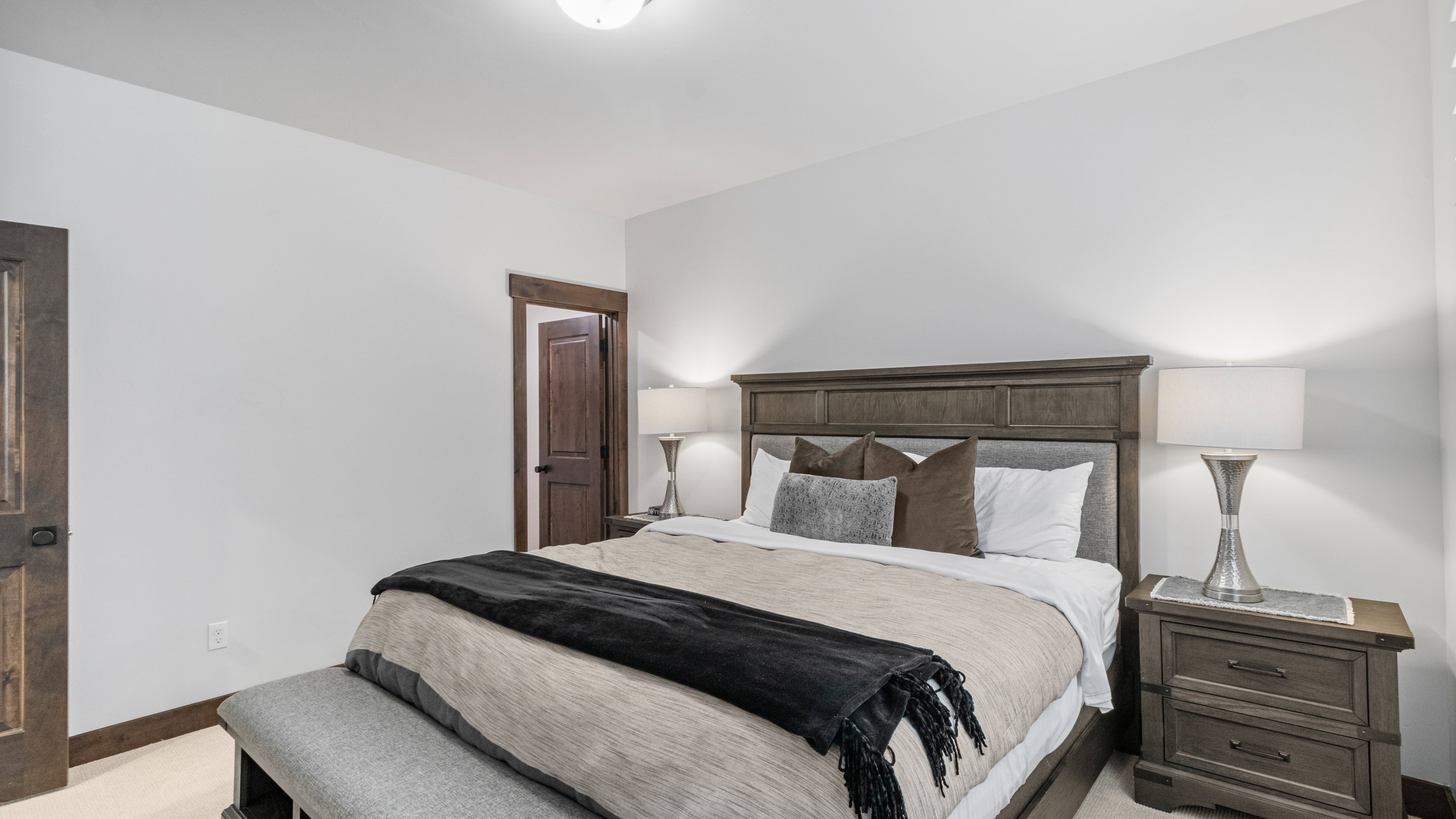 Bedroom featuring light carpet