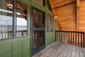 Entrance to property featuring a deck