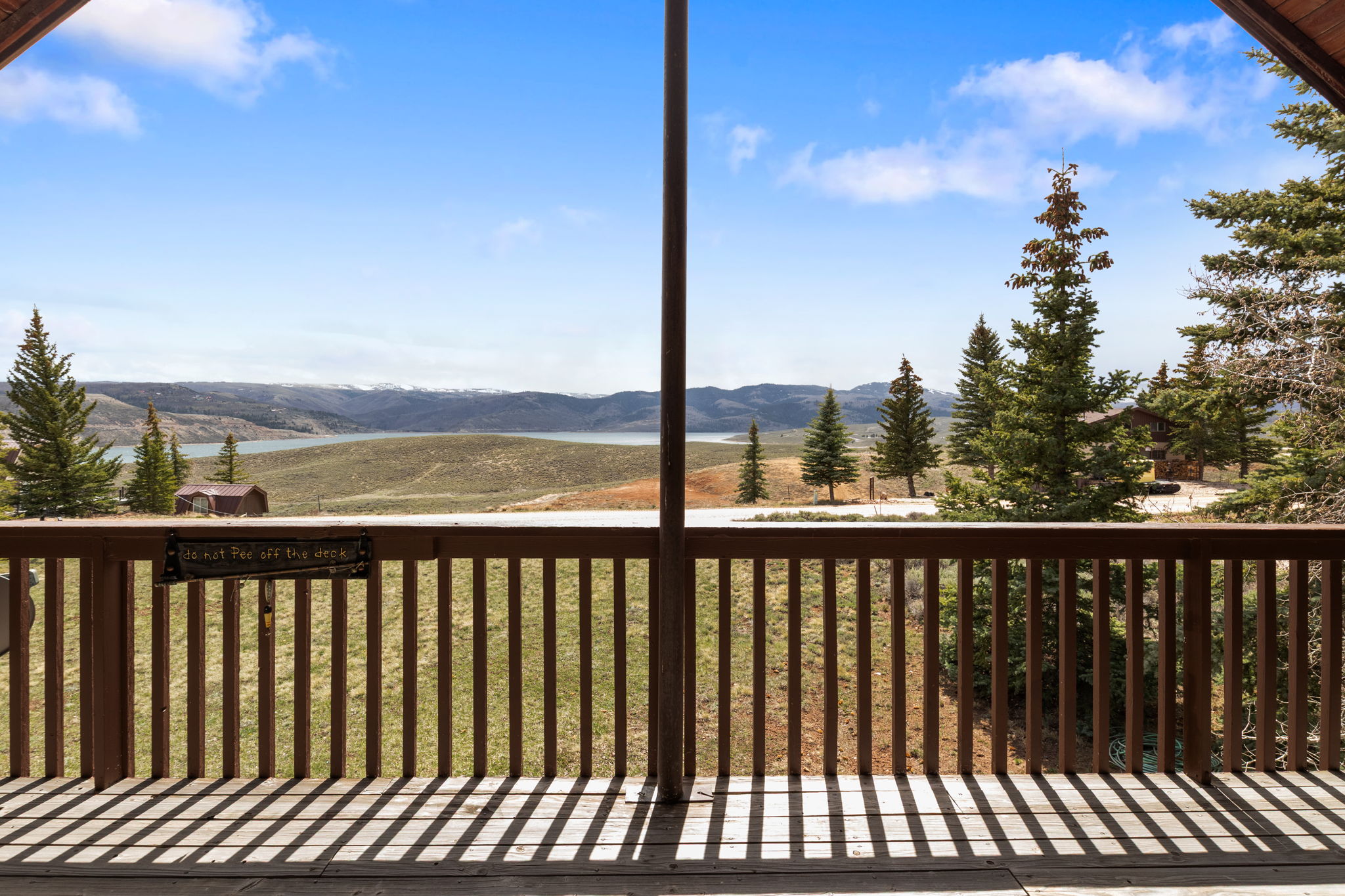 Wooden terrace featuring a mountain view