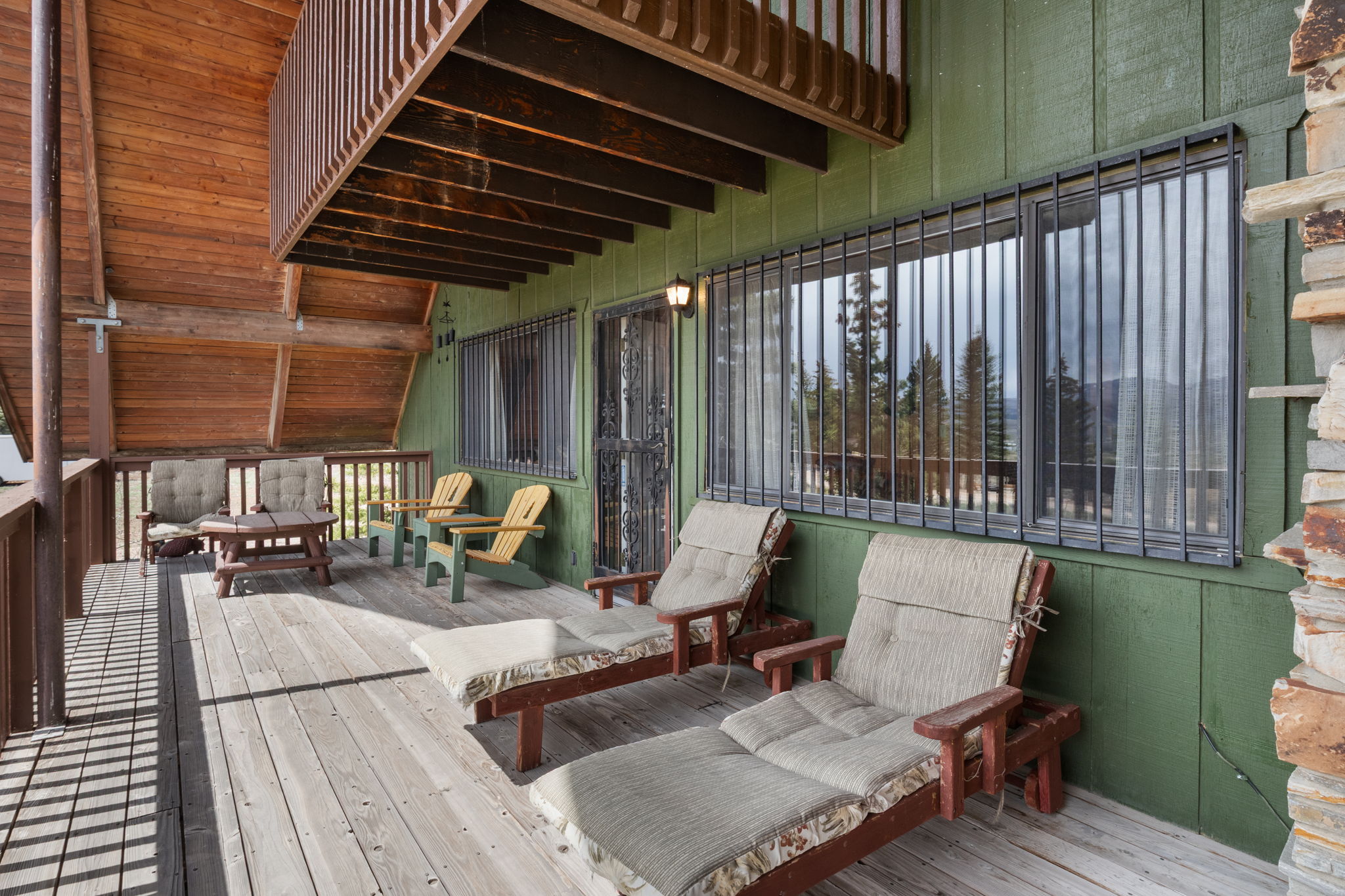 Wooden deck featuring an outdoor living space