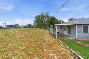 View of yard with a patio area